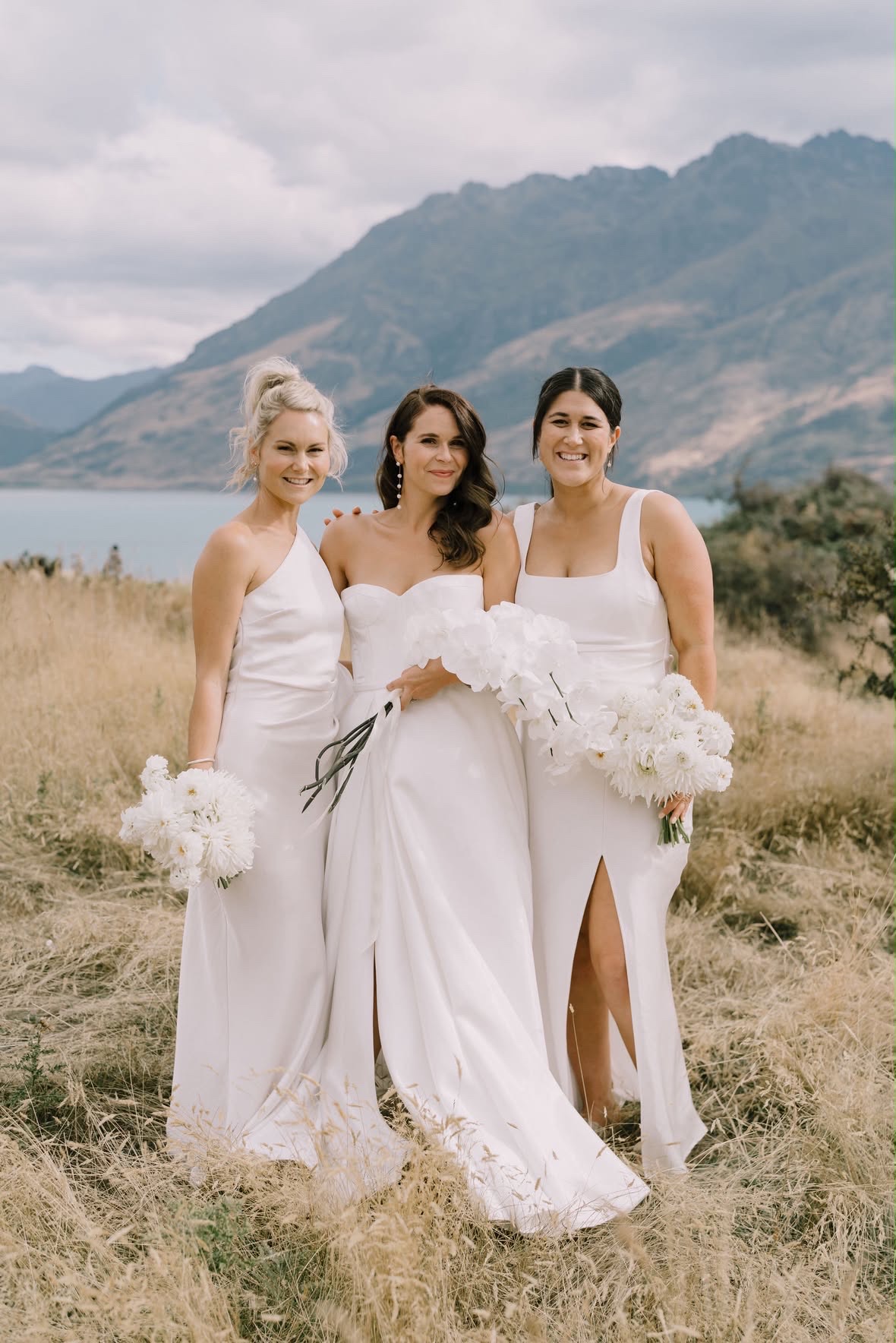 Bride with her two bridesmaids in white