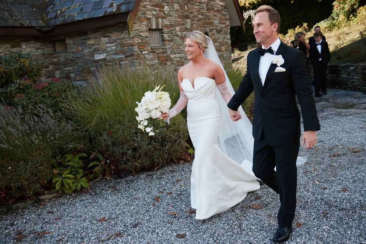 Bride and groom walking the gravel path after the ceremony