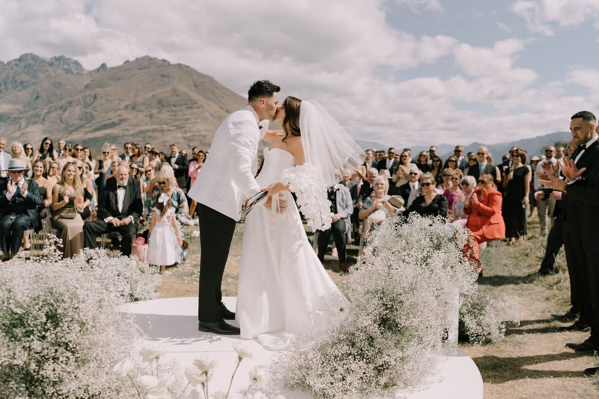 Bride and groom's first kiss at the altar